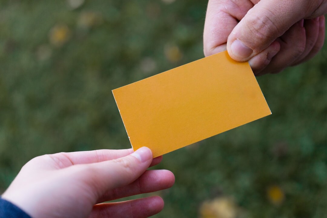 Business professionals exchanging business cards at a networking conference